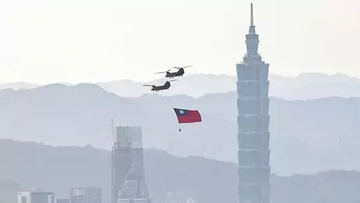 A CH-47 flies across Taipei during a rehearsal ahead of National Day celebrations