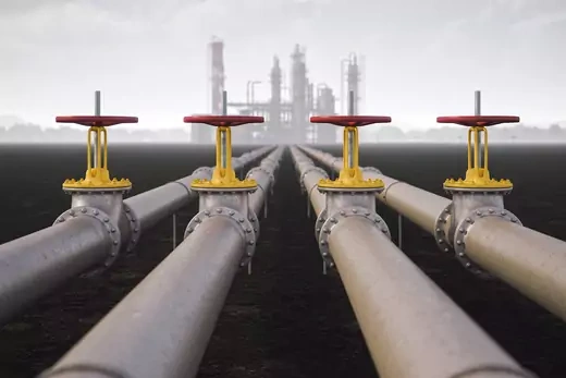 A photo of steel oil pipelines at a refinery.