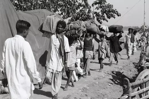 Refugees from the northeastern are of India arrive in Calcutta after evacuating their homes. 