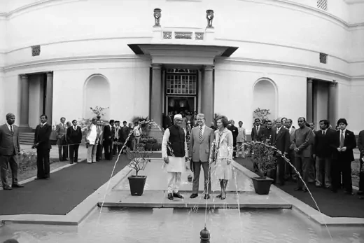 Indian Prime Minister Morarji Desai and President Jimmy Carter and Mrs. Rosalynn Carter on a bridge over untroubled waters in the Indian Parliament in New Delhi.