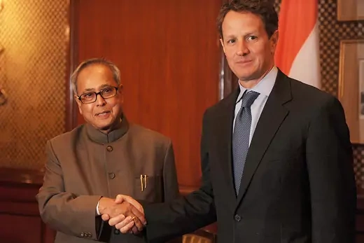 Timothy Geithner shakes hands with Pranab Mukherjee during a meeting in New Delhi. 