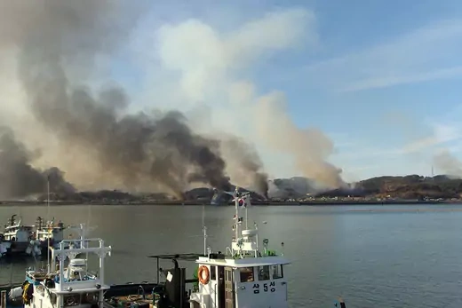 Smoke rises from Yeonpyeong after North Korean artillery hit the South Korean island.