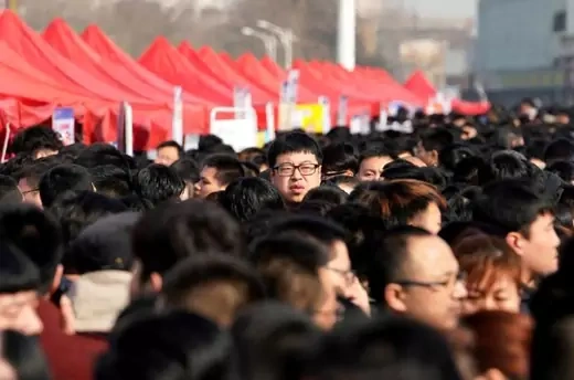 A man looks over a crowd in Shijiazhuang, Hebei province, China.