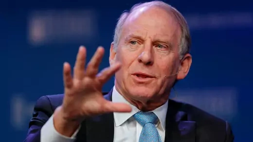 Richard Haass raises hand while speaking at event