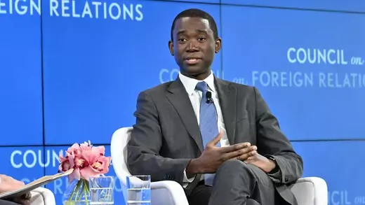Wally Adeyemo looking to the left while speaking on stage at CFR