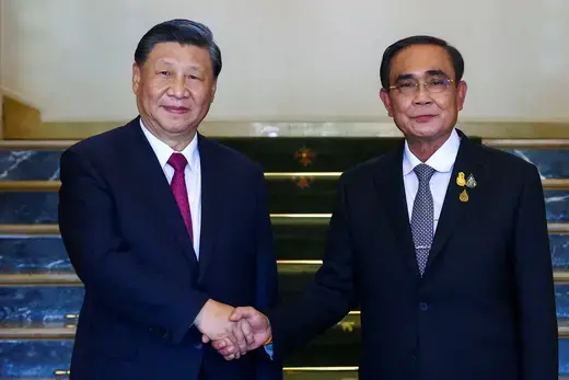 Chinese President Xi Jinping shakes hands with Thai Prime Minister Prayut Chan-ocha