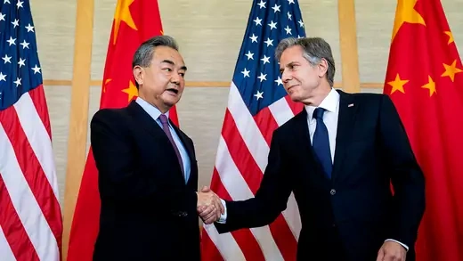 Chinese foreign minister Yi shakes hands with US secretary of state Blinken