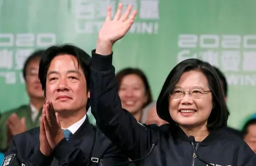 President Tsai Ing-wen waves to a crow while she stands beside Vice President-elect William Lai at an election rally.