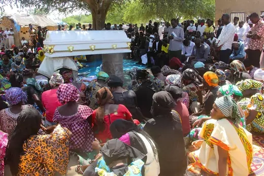 People gather around the coffin of Oredje Narcisse, the Chadian journalist who was killed during a pro-democracy demonstration, as they attend his burial ceremony in N'Djamena, Chad.