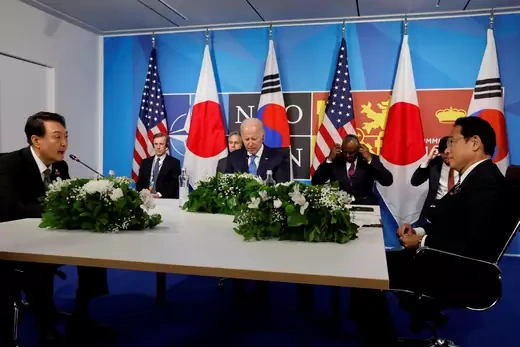 South Korea's President Yoon Suk-yeol and Japanese Prime Minister Fumio Kishida meet with U.S. President Joe Biden during a NATO summit in Madrid.