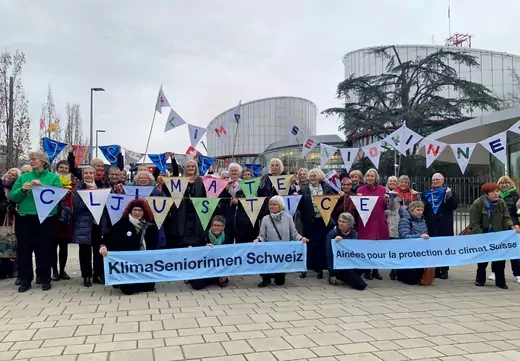 A group from the Senior Women for Climate Protection association hold banners outside the European Court of Human Rights in Strasbourg, France March 29, 2023.