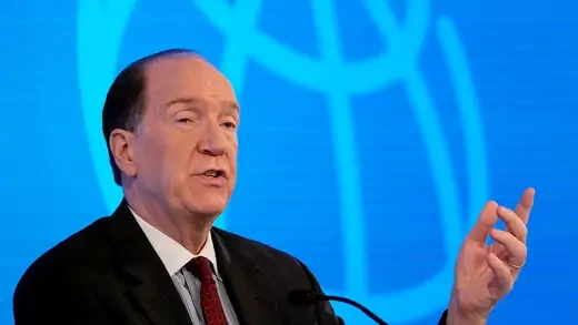 David Malpass speaks at event with World Bank logo on screen behind him