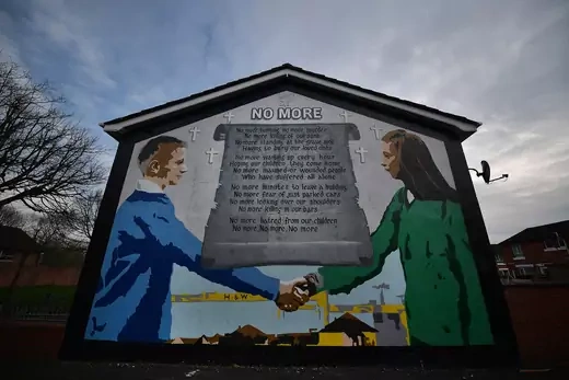 A peace mural adorns a building in a loyalist neighborhood of Belfast
