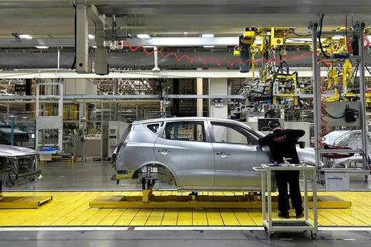 A staff member works on an assembly line manufacturing Geely's GX6 cars, at the Geely's plant in Chengdu, Sichuan province, China April 13, 2023.