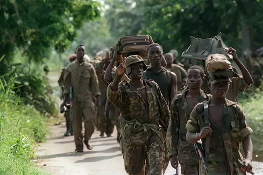 An AFDL soldier flashes the victory sign as his unit marches on Kinshasa.