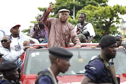 Opposition leader Étienne Tshisekedi gestures toward police blocking him from holding a political rally in Kinshasa.