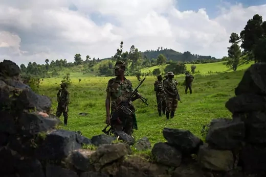 Fighters from the March 23 Movement (M23) stand guard at a base on the outskirts of Goma.