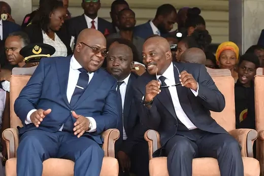 Félix Tshisekedi sits next to Kabila at his inauguration ceremony.