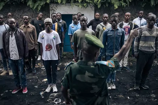Volunteers seeking to join the DRC army stand at attention at a recruiting base in Goma.