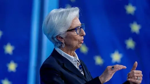 Christine Lagarde talking at event in front of EU flag