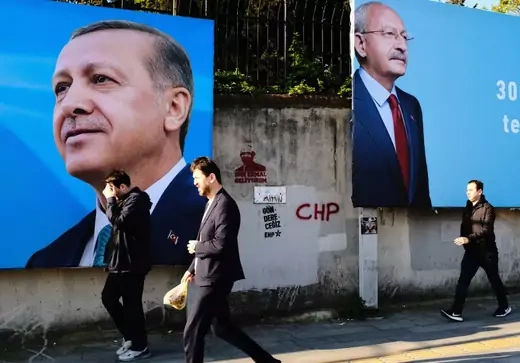 People in Istanbul, Turkey passing by a photo of opposition Republican People's Party (CHP) leader Kemal Kilicdaroglu and Turkish President Recep Tayyip Erdogan as general elections are set to be held in Turkey.