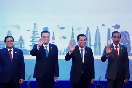Southeast Asian leaders wave in a group photo.