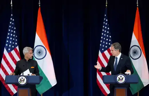 U.S. Secretary of State Antony Blinken and India's Foreign Minister Subrahmanyam Jaishankar as viewed speaking at two podiums in front of American and Indian flags.