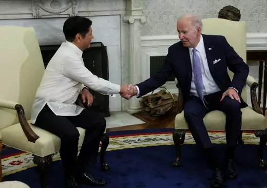 Philippine President Marcos shakes hands with President Biden.