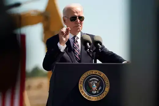 U.S. President Joe Biden speaks on rebuilding American manufacturing at the groundbreaking of a new Intel semiconductor manufacturing facility.