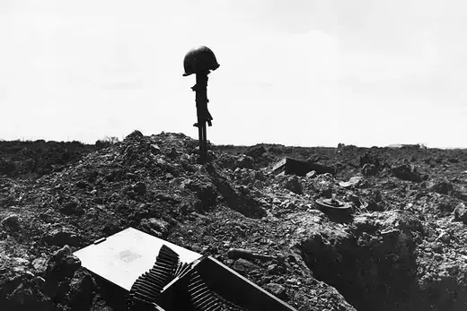 A monument to an unknown American soldier as viewed on a shell-blasted shore of Normandy.