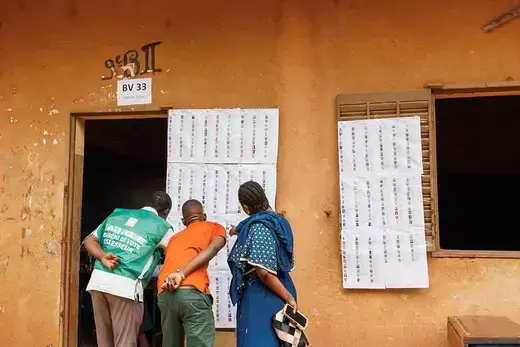 Voters look for their names on the voters roll at a polling station ahead of Mali's referendum vote in Bamako, Mali on June 18, 2023.