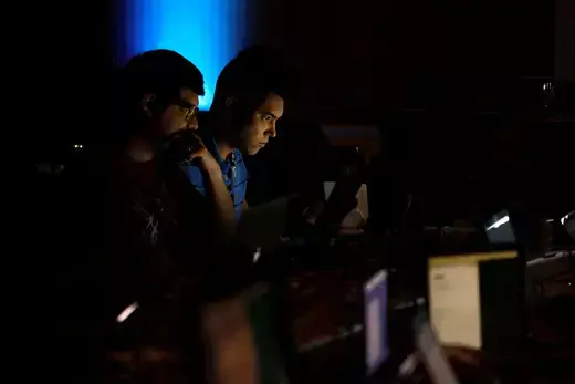 Andrew Beard and Barrett Darnell compete in a contest during the Def Con hacker convention in Las Vegas, Nevada.