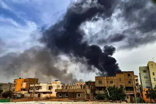 Smoke billows from a warehouse in Khartoum amidst ongoing heavy fighting on June 7, 2023.