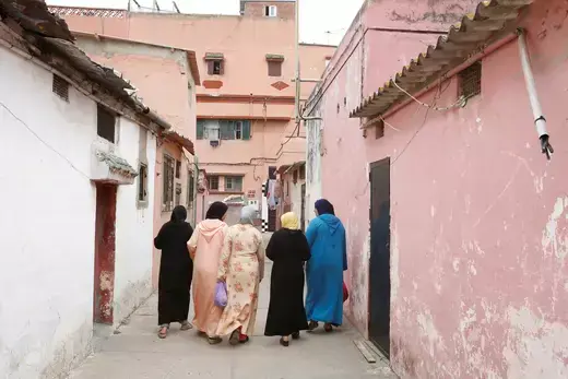 Moroccan women walk along a narrow street in Mohamadia, Morocco, April 28, 2018.
