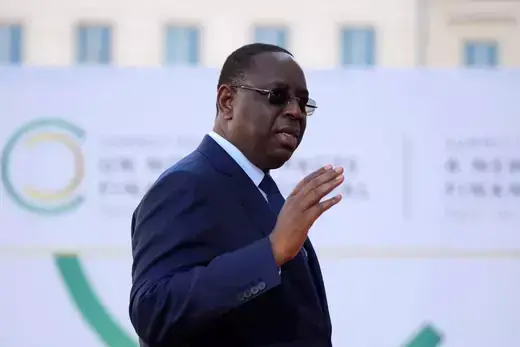 Senegal's President Macky Sall gestures his hand during the closing session of the New Global Financial Pact Summit in Paris.