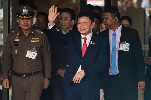 Former Thai Prime Minister Thaksin Shinawatra and his entourage arrive at Don Mueang International Airport in Bangkok 