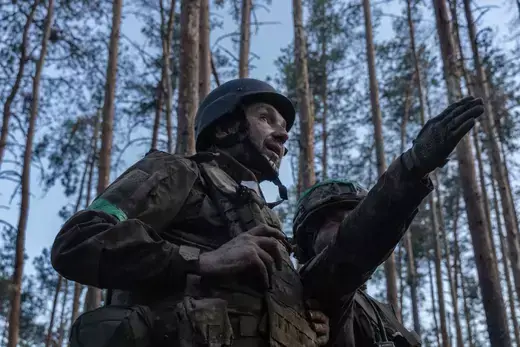 A Ukrainian soldier indicates the positions of the Russian snipers in Serebryansky Forest on July 27, 2023.