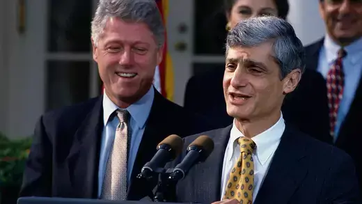 Robert Rubin speaking next to Bill Clinton