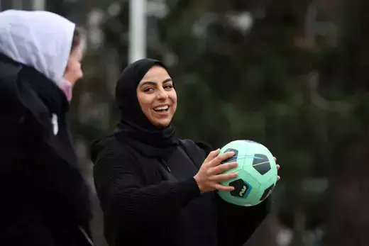 Supporters of the women soccer team "Les Hijabeuses" play soccer in front of the city hall in Lille as part of a protest as French Senate examines a bill featuring controversial hijab ban in competitive sports in France, February 16, 2022.