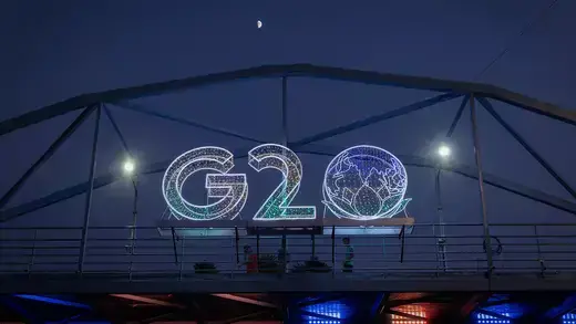 Sign of letters spelling G20 on a major road