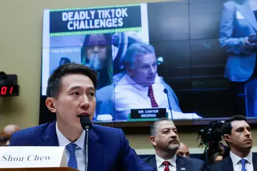 TikTok Chief Executive Shou Zi Chew testifies before a House Energy and Commerce Committee hearing, sitting in front of a screen showing "deadly TikTok challenges."