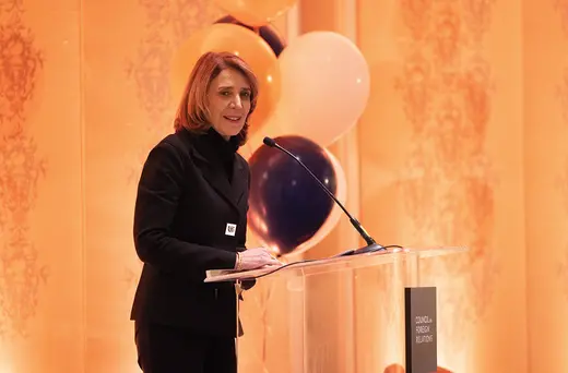 Ruth Porat standing at podium 