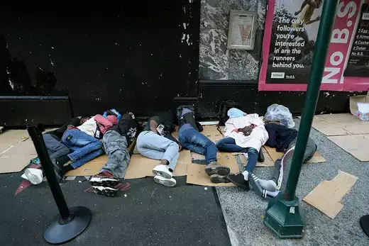 Migrants sleep outside the Roosevelt Hotel in New York.