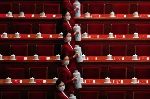 Attendants carry tea before the opening ceremony of the Twentieth National Congress of the Chinese Communist Party held in the Great Hall of the People in Beijing, China.