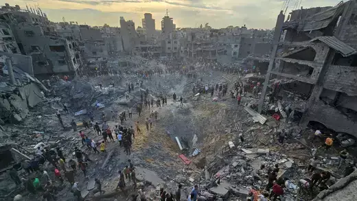 Palestinians search for casualties at the site of Israeli strikes on Jabalia refugee camp in the northern Gaza Strip on October 31, 2023.