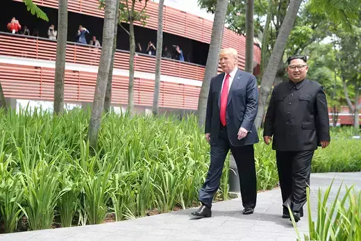 U.S. President Donald Trump and North Korean leader Kim Jong Un walk through Sentosa Island in Singapore 