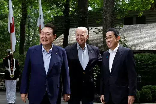 U.S. President Joe Biden, Japanese Prime Minister Fumio Kishida, and South Korean President Yoon Suk Yeol pose during the trilateral summit at Camp David 