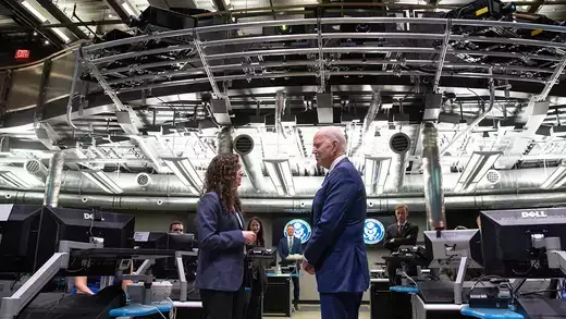 US President Joe Biden (C) speaks with the Director of the National Counterterrorism Center Christine Abizaid (C L), as he tours the Center's Watch Floor at the Office of the Director of National Intelligence in McLean, Virginia.