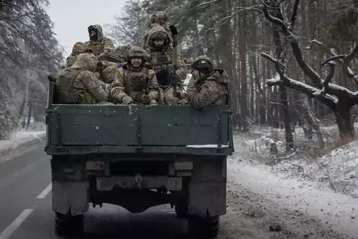 Ukrainian soldiers as viewed in the back of a truck bed.