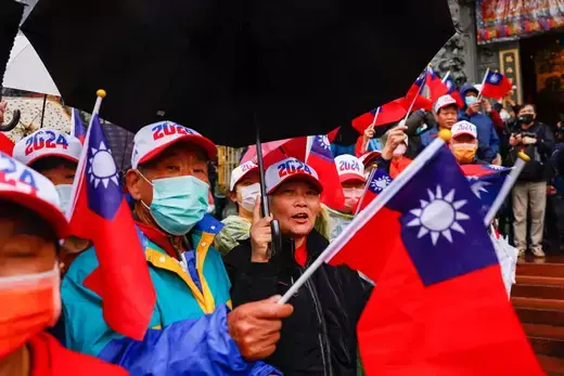 Supporters of Hou Yu-ih, a candidate for Taiwan's presidency from the main opposition party Kuomintang (KMT) wave Taiwanese flags at a campaign event in New Taipei City, Taiwan on January 3, 2024.